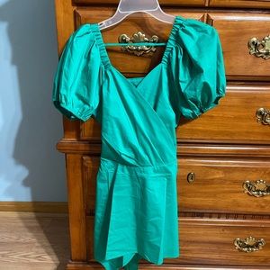 Green tunic with belt